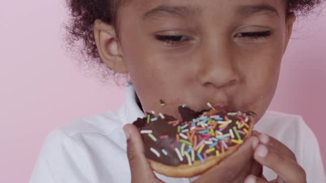 A Boy Eating His Delicious Donut