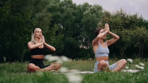 Beautiful Women Performing Yoga