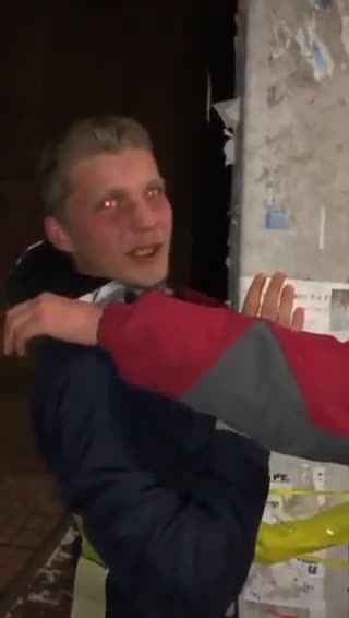 Ukraine: young men/teens tied to pole