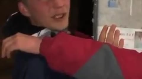 Ukraine: young men/teens tied to pole