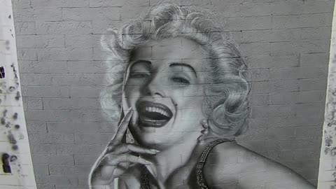 Airbrushing. A drawing on the wall. Marilyn Monroe.