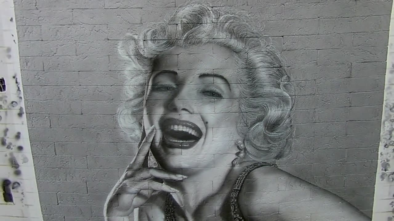 Airbrushing. A drawing on the wall. Marilyn Monroe.