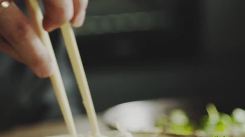 A Chef Checking The Noodles Of Bowl Dish