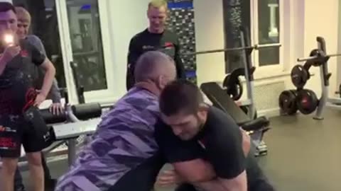 "Father-Son Grappling: Khabib Nurmagomedov Honors His Late Father, Abdulmanap Nurmagomedov"