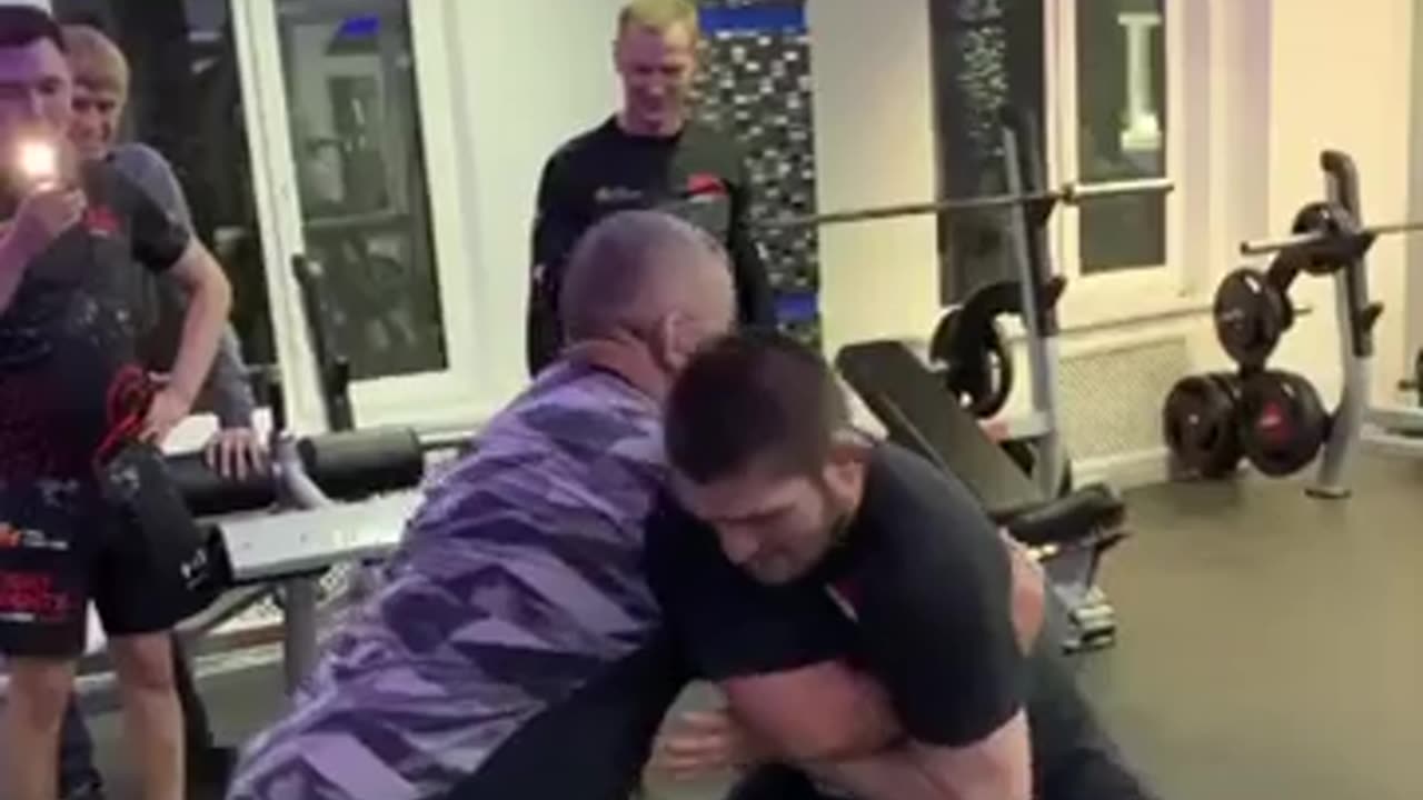 "Father-Son Grappling: Khabib Nurmagomedov Honors His Late Father, Abdulmanap Nurmagomedov"