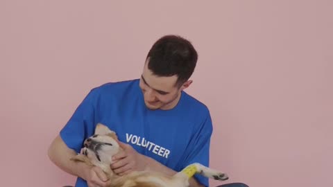 man play with dogy