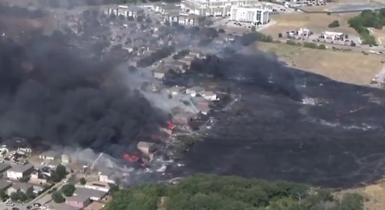 A massive grass fire in Balch springs Texas burning homes