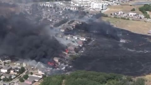 A massive grass fire in Balch springs Texas burning homes