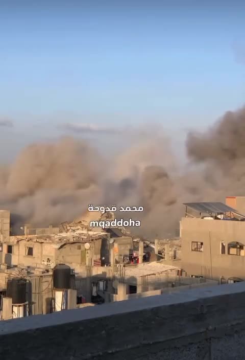 An Israeli air strike destroys a residential building in the Nusairat refugee camp, central Gaza.