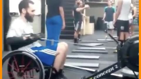 man in wheelchair doing exercises