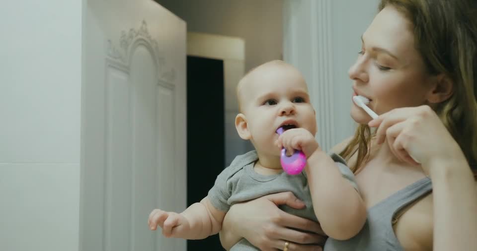 Beautiful funny babies video using toothbrush with mom