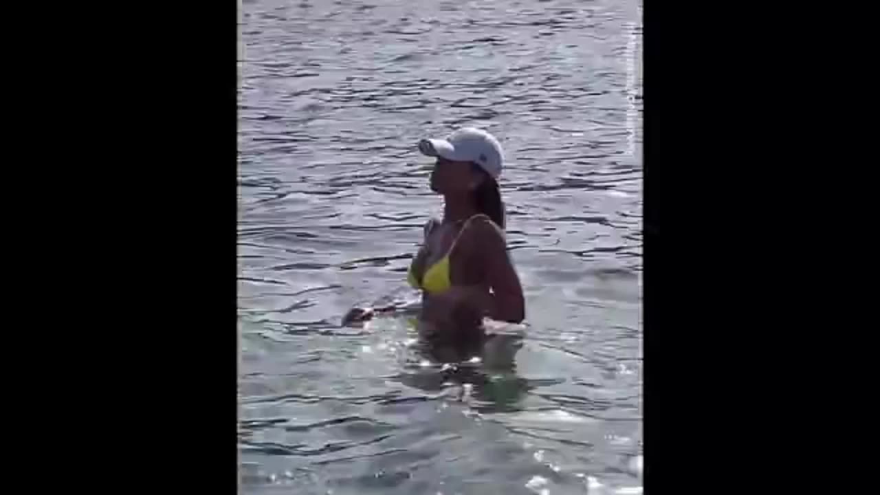 Lori Harvey makes a splash swimming in her tiny yellow bikini