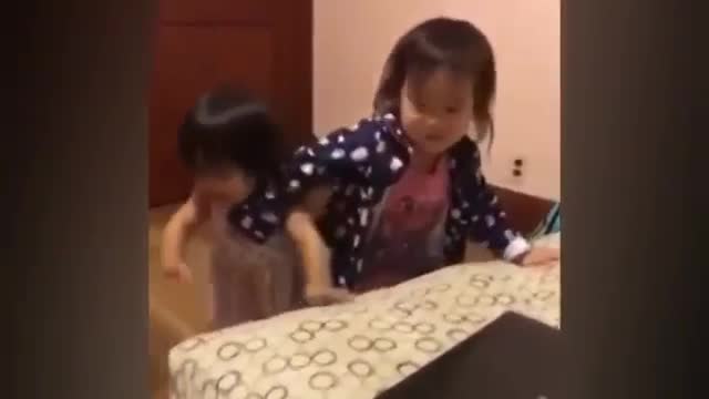 Little girl copy her sister