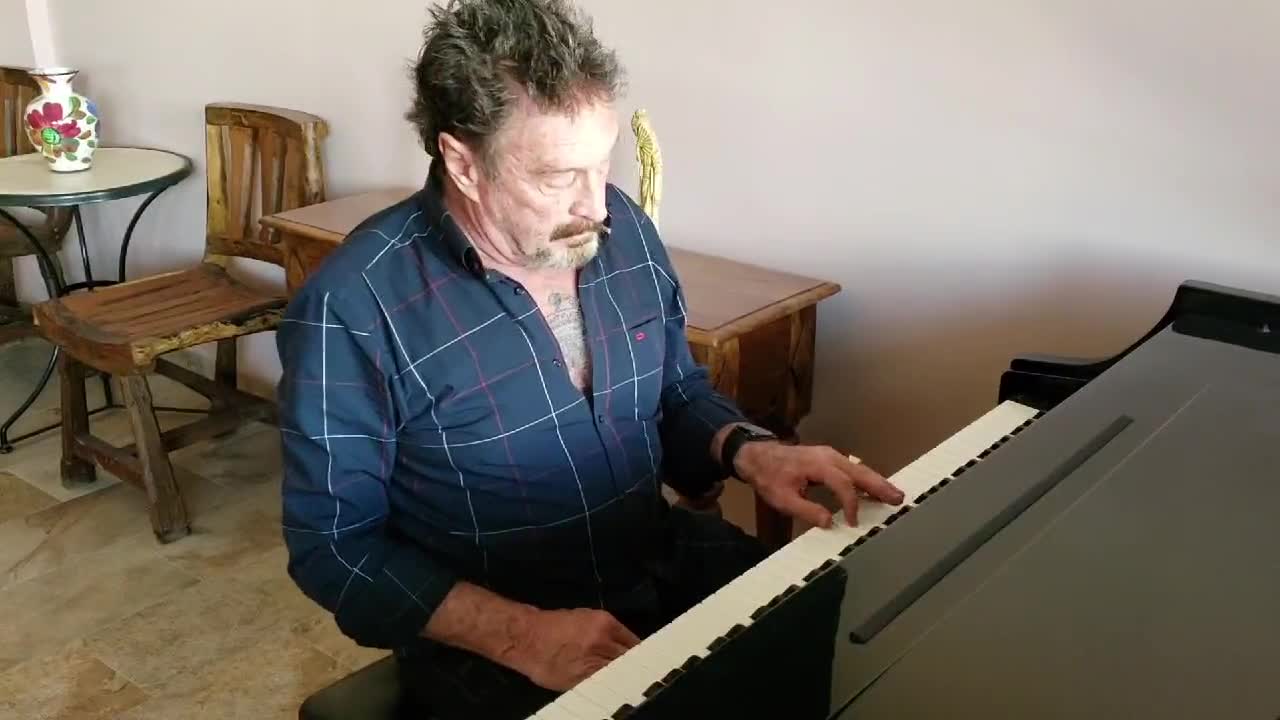 John McAfee Plays Piano