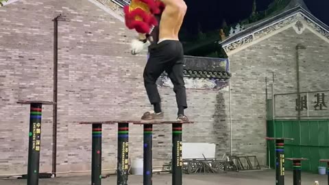 Practicing lion dance on the top platform