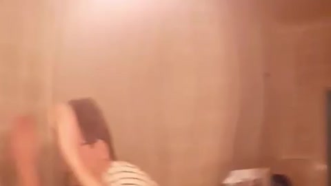 Guy hitting light and it breaks and hits friend