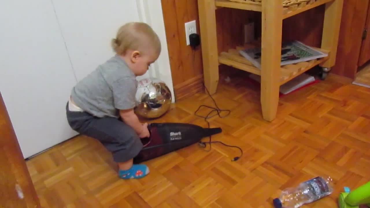 Baby Plays With Dustbuster, Freaks Out When It Turns On