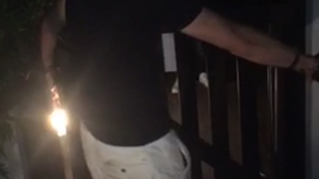 Man almost jumps over balcony falls back