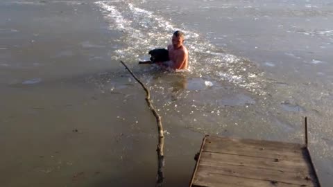 Man Smashes Through Icy River To Save His Dog