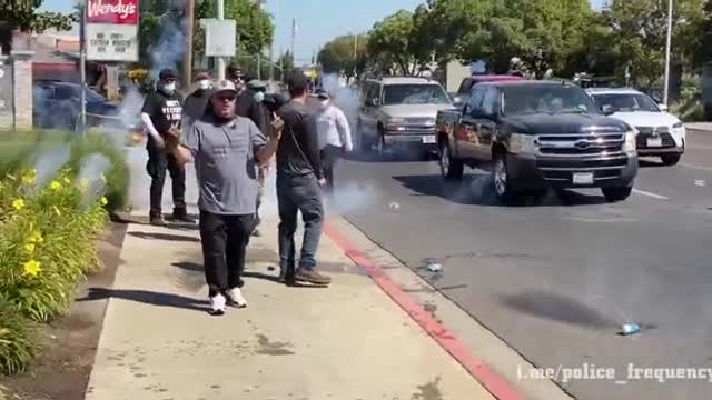 Antifa protesters are countered with pepper balls defending a "Straight Pride" rally