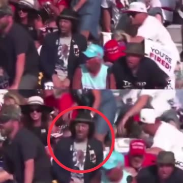 Notice the man in the black hat is the only one who doesn’t move while shots are being fired.