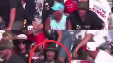 Notice the man in the black hat is the only one who doesn’t move while shots are being fired.