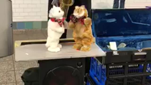 Man plays sax stuffed toys dance