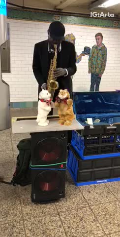 Man plays sax stuffed toys dance