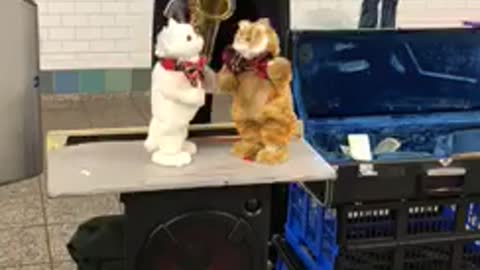 Man plays sax stuffed toys dance