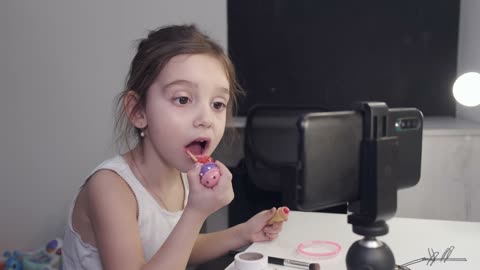 Little Girl Applying Lipstick