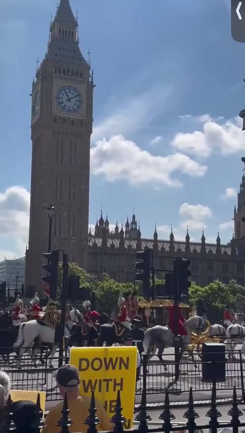 Fake King "Sausage-Fingers" Charles (his double/masked actor) gets some flak in London