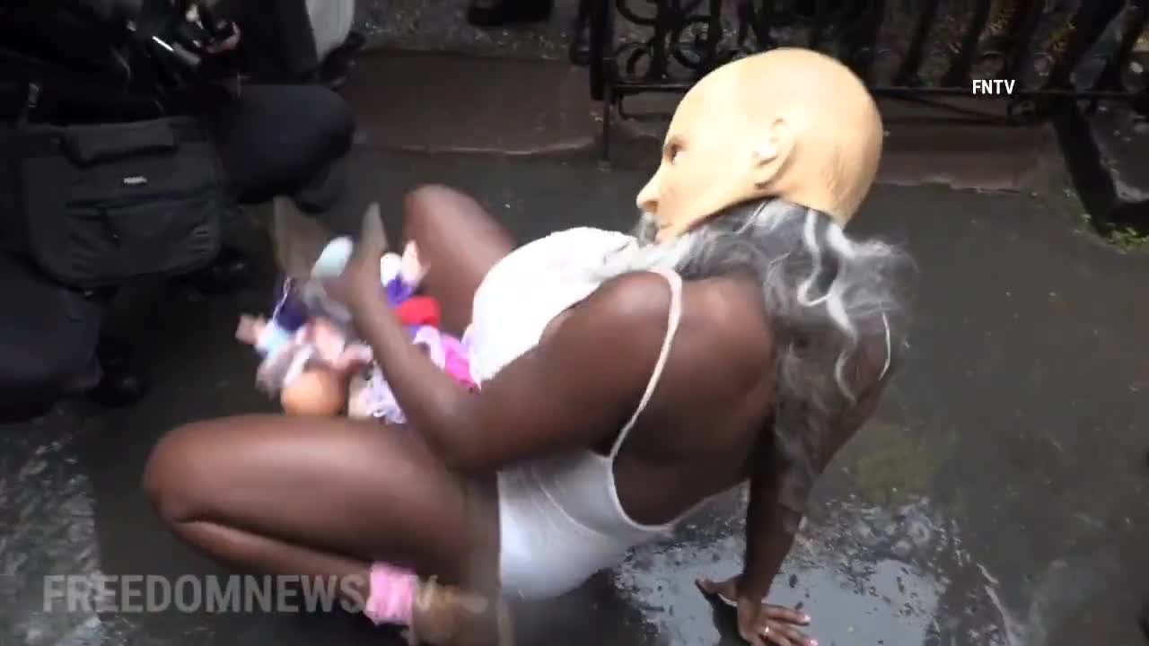 Pro-abortion activist shows utter display of lack of humanity in front of individuals praying at a Catholic Church.