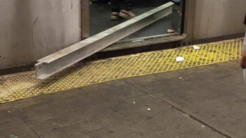 Builder with a Beam Boards Brooklyn Train