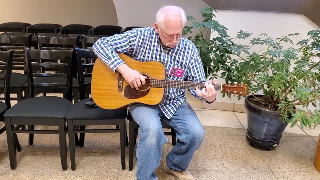 Dad playing Martin Guitar owned by Hank Williams Sr