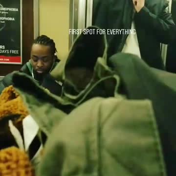 Guy is shaving his face on moving subway car