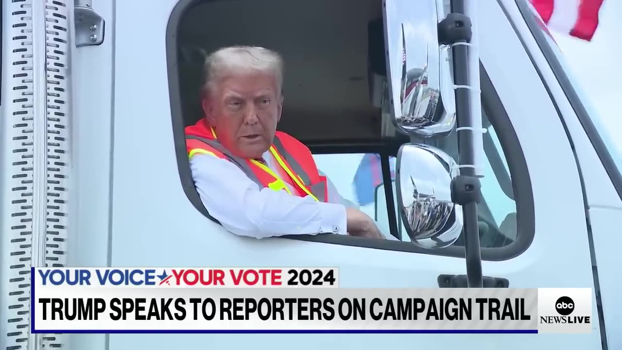 Trump speaks to reporters from garbage truck on campaign trail