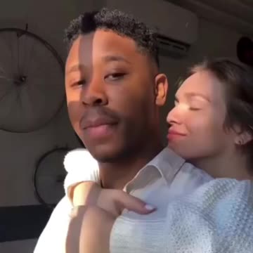 Mixed Couple Stare At Sunset