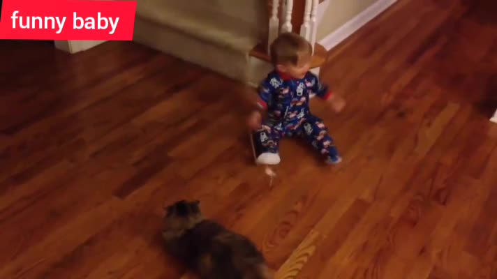 Baby is playing with the cat at home and her parents are happy