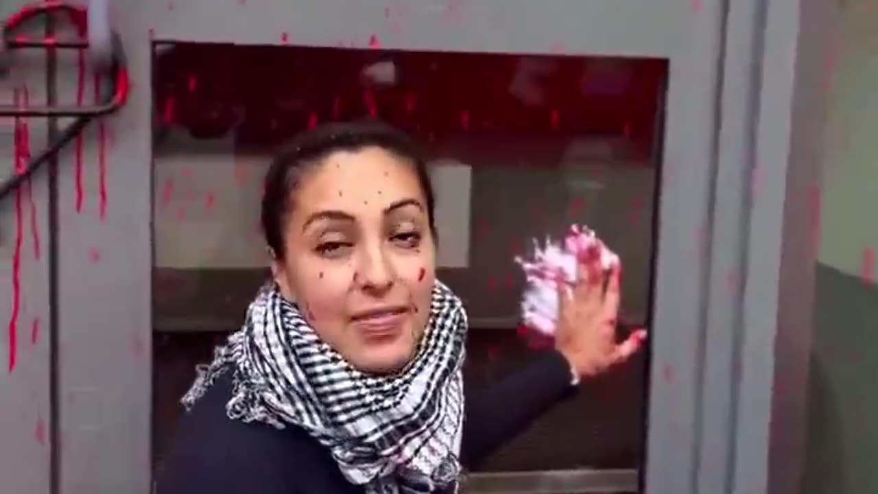 Palestine activists spray red paint over the London headquarters of public