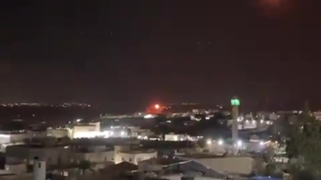 Video showing dozens of missiles launched from Iran falling in Israel.