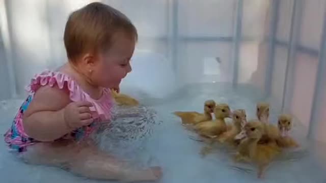 baby with chicks in the bath