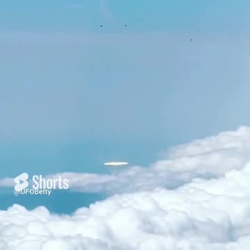 Silver Disc UFO UAP filmed outside Airplane