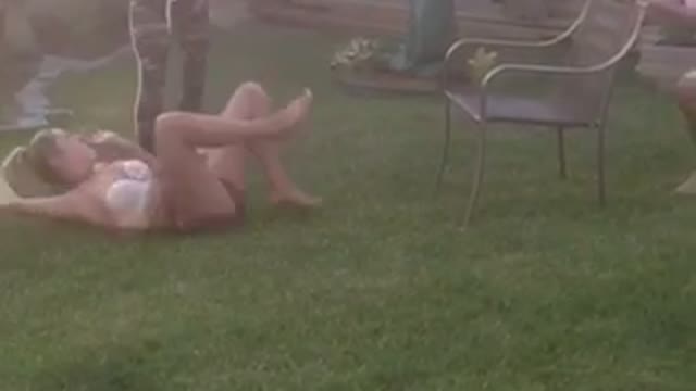 Girl back flip off back yard chair