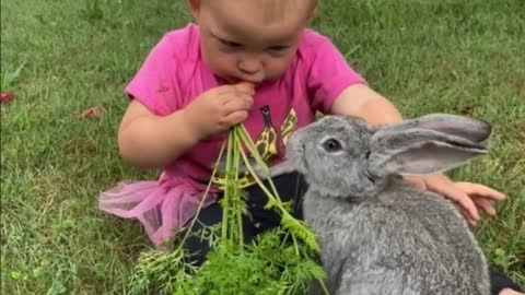 Sharing a carrot with her bunny