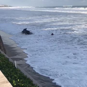 Woman struggles to get on water ski