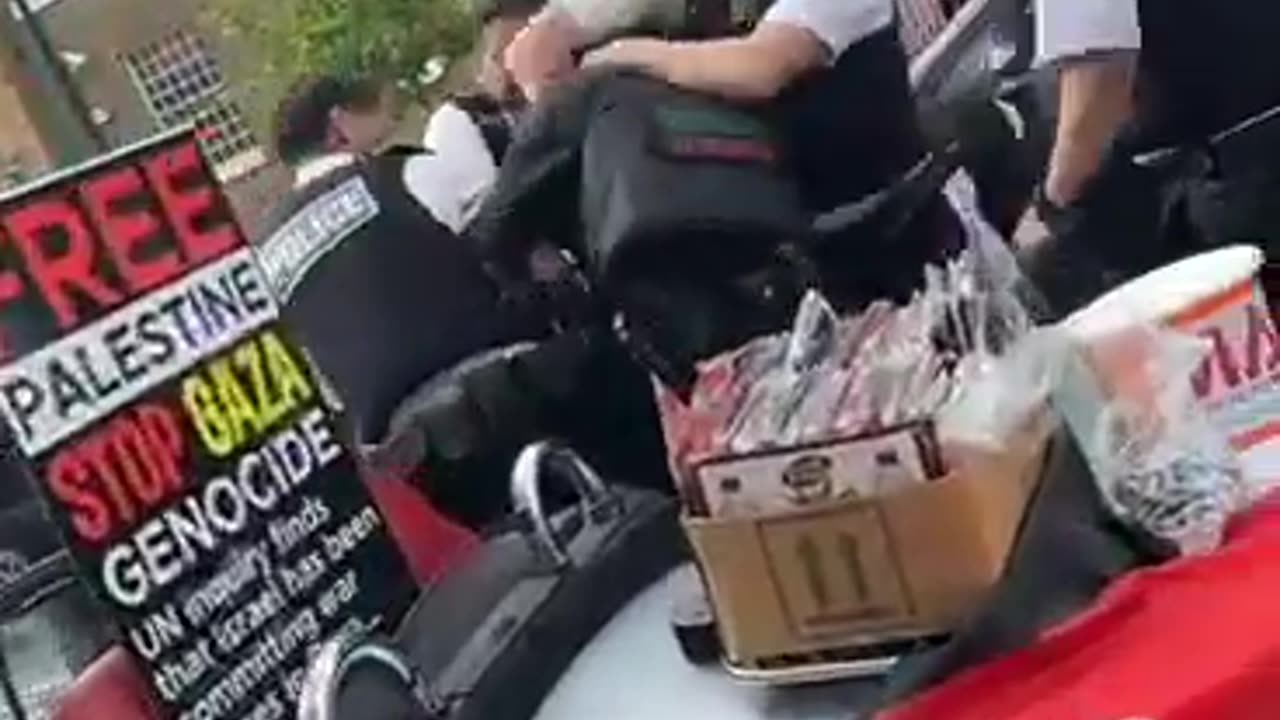 Police arrest a pro Palestine protester outside whitechapel Road today