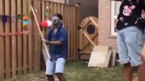 Blindfolded Man hits his friend in the middle