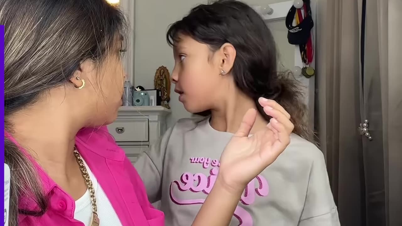 Big sister helps fix younger sister's hair disaster