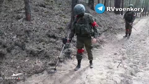 Ukraine War - Russian servicemen check forest roads