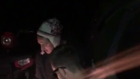 Guy with white beanie hitting beer with his head